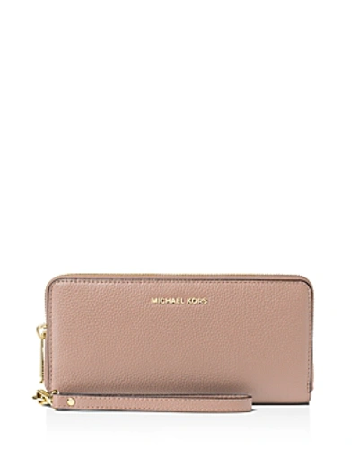 Shop Michael Michael Kors Mercer Travel Continental Wallet In Fawn Brown/gold