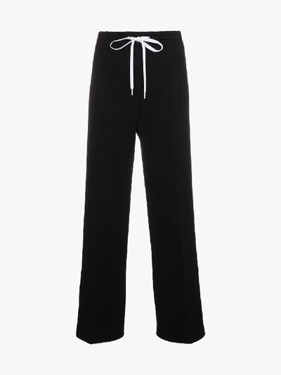 Shop Miu Miu Contrast Logo Striped Trousers In Black