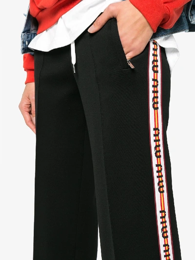 Shop Miu Miu Contrast Logo Striped Trousers In Black