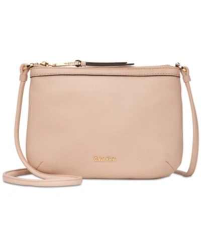 Shop Calvin Klein Carrie Pebble Leather Crossbody In Dessert Taupe