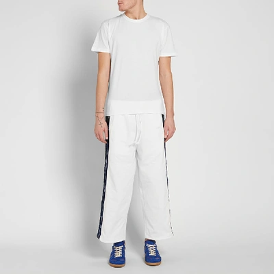 Shop Dima Leu Cropped Wide Fit Stripe Track Pant In White