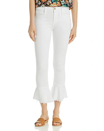 Shop Frame Le Skinny De Jeanne Flounce Raw-edge Jeans In Blanc
