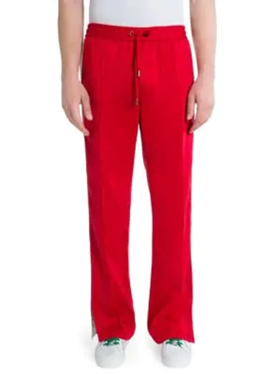 Shop Versace Cotton-blend Drawstring Sweatpants In Red