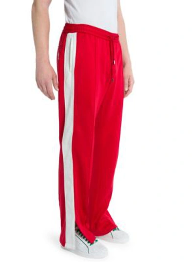 Shop Versace Cotton-blend Drawstring Sweatpants In Red