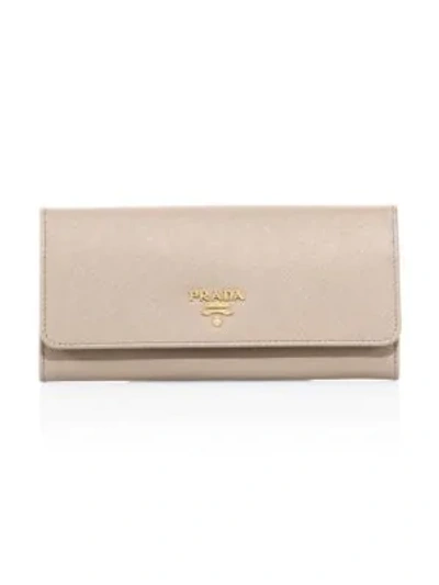 Shop Prada Saffiano Leather Continental Flap Wallet In Cammeo
