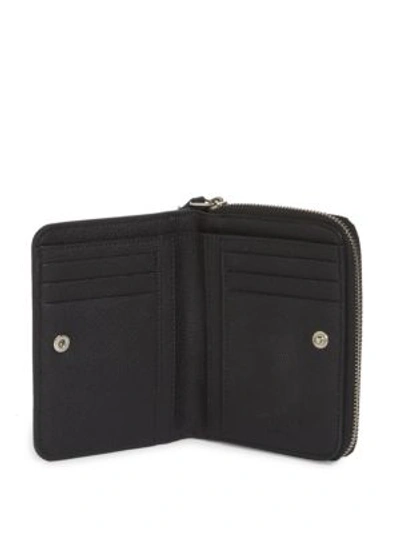 Shop Saint Laurent Compact Leather Wallet In Black