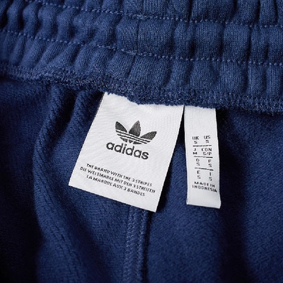 Shop Adidas Originals Adidas Cuffed 3 Stripe Track Pant In Blue