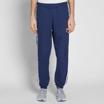 Shop Adidas Originals Adidas Cuffed 3 Stripe Track Pant In Blue