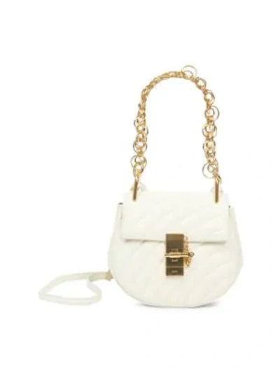 Shop Chloé Small Drew Quilted Leather Saddle Bag In White
