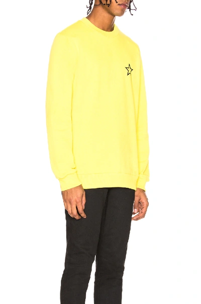 Shop Givenchy Star Crewneck Sweatshirt In Yellow