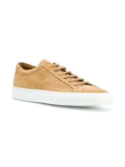 Shop Common Projects Achilles Low Sneakers - Nude & Neutrals