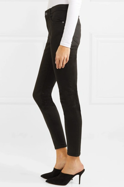 Shop Madewell Mid-rise Skinny Jeans In Black