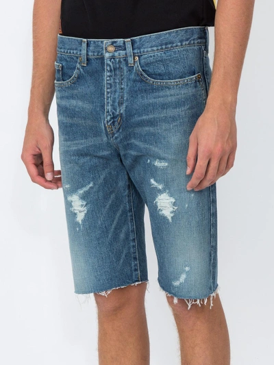 Shop Saint Laurent Distressed Denim Shorts