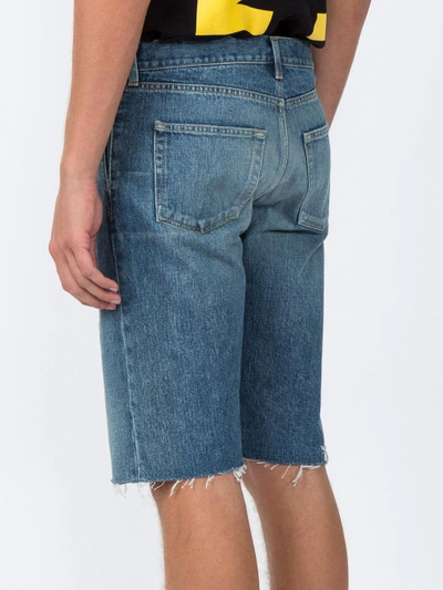 Shop Saint Laurent Distressed Denim Shorts
