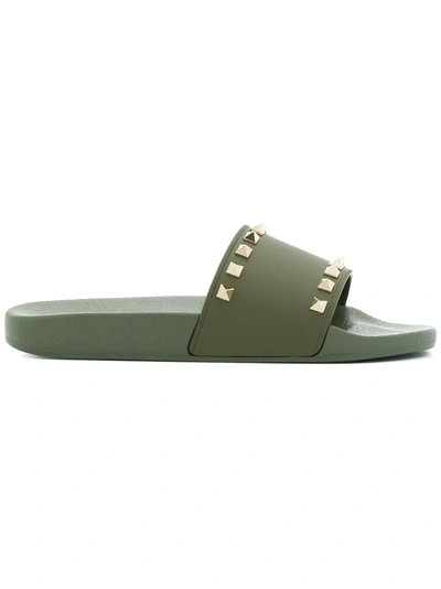 Shop Valentino Rockstud Slide Sandals In Green