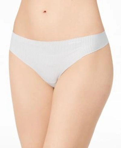 Shop Calvin Klein Invisibles Thong D3428 In Parallel Lines