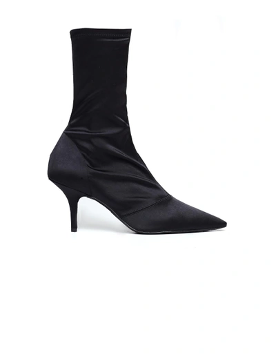 Shop Yeezy Onyx Satin Booties In Black