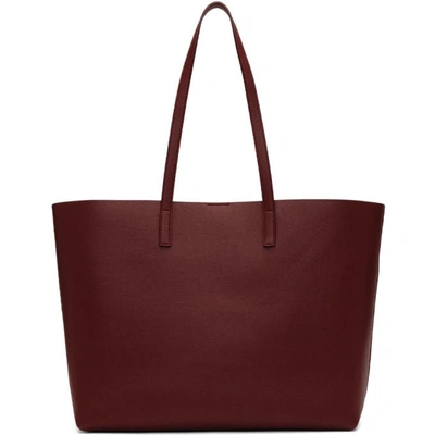 Shop Saint Laurent Burgundy East West Shopping Tote In 6219 Paliss