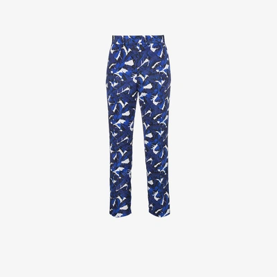 Shop Msgm Leaf Print Pants In Blue