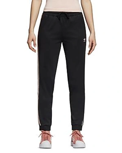Shop Adidas Originals Embroidered Jogger Pants In Black