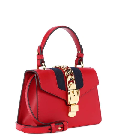 Shop Gucci Sylvie Mini Leather Crossbody Bag In Red