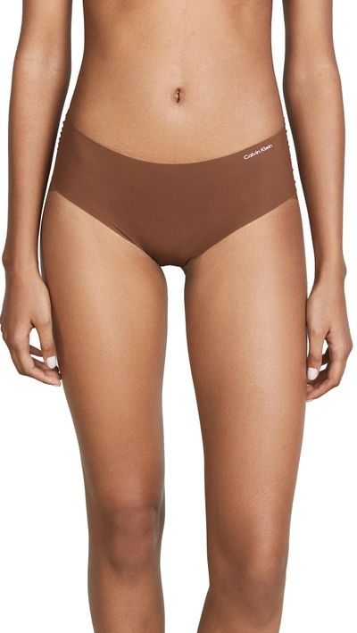 Shop Calvin Klein Underwear Invisibles Hipster Briefs In Cinnamon