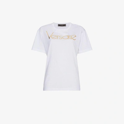 Shop Versace Metallic Logo Print Short Sleeve T Shirt In White