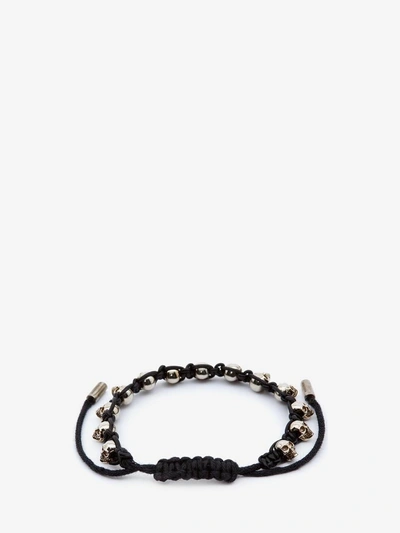 Shop Alexander Mcqueen Multi Skull Bracelet In Black