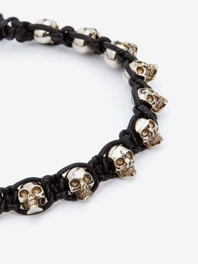 Shop Alexander Mcqueen Multi Skull Bracelet In Black