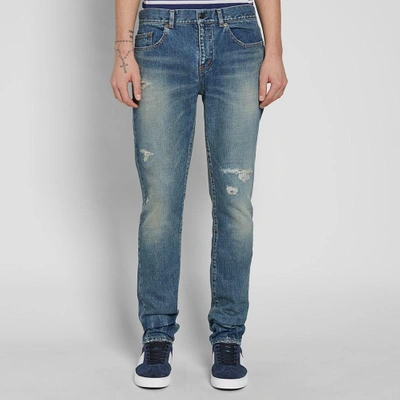 Shop Saint Laurent Low Rise Skinny Trash Jean In Blue