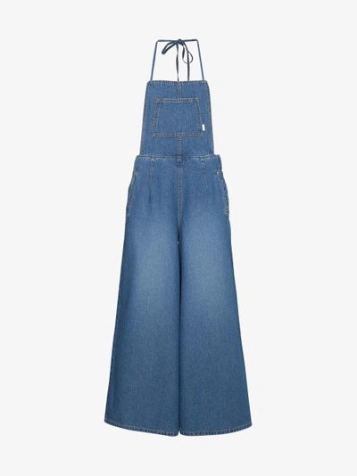 Shop Sjyp Denim Jumpsuit With Halter Neck In Blue