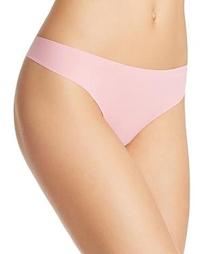 Shop Calvin Klein Invisibles Thong In Penelope Pink