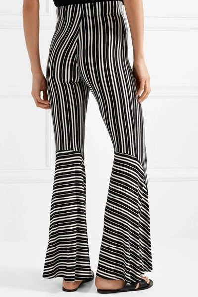Shop Beaufille Lamos Striped Ribbed Stretch-knit Flared Pants In Black