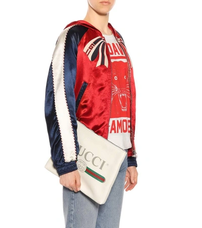 Shop Gucci Printed Leather Clutch In White