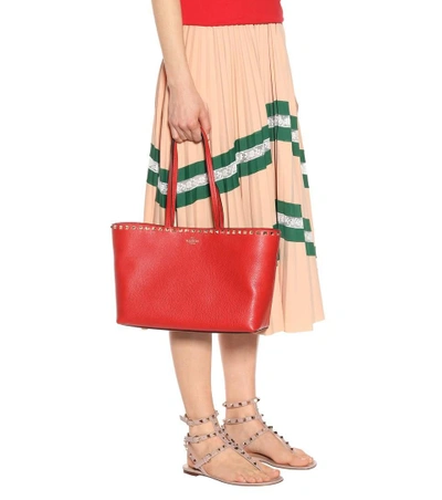 Shop Valentino Rockstud Leather Shopper In Red