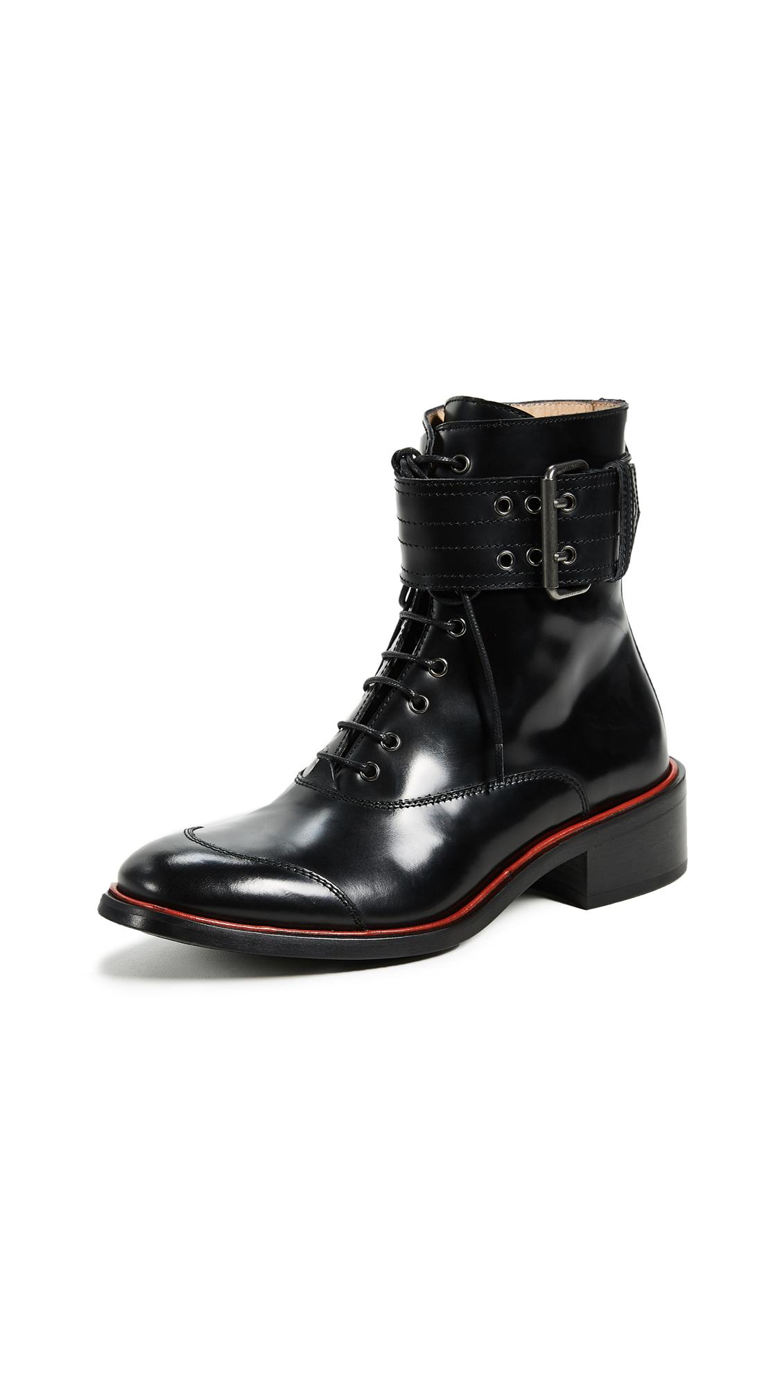 black boots with red stripe