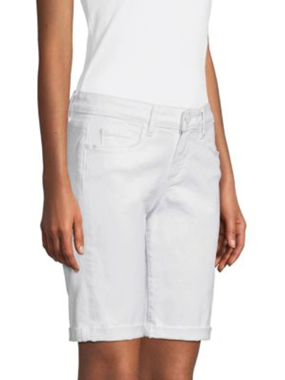 Shop Paige Jax Roll Cuff Denim Bermuda Shorts In Crisp White