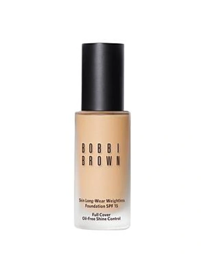 Shop Bobbi Brown Skin Long-wear Weightless Foundation Spf 15 In Ivory 0.75