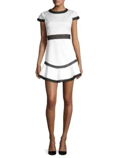 Shop Alice And Olivia Rapunzel Flounce Mini Dress In White Black