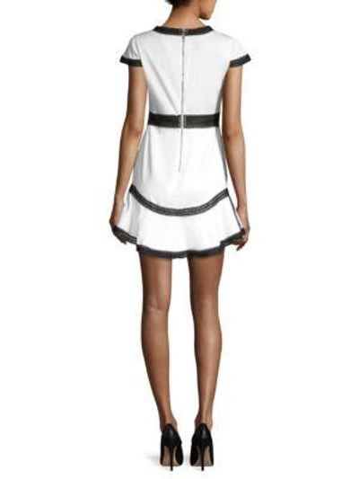 Shop Alice And Olivia Rapunzel Flounce Mini Dress In White Black