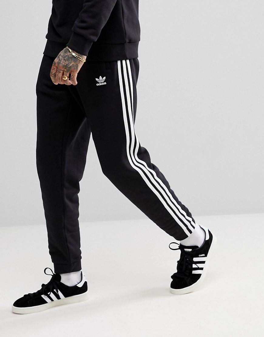 adidas originals adicolor three stripe track pants in black