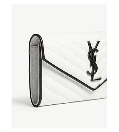 Shop Saint Laurent Monogram Quilted Pebbled Leather Wallet In White/black