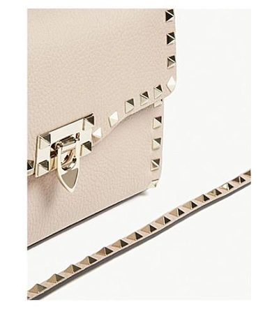 Shop Valentino Rockstud Leather Cross-body Bag In Poudre
