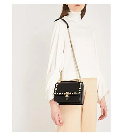 Shop Fendi Kan I Studded Leather Cross-body Bag In Black