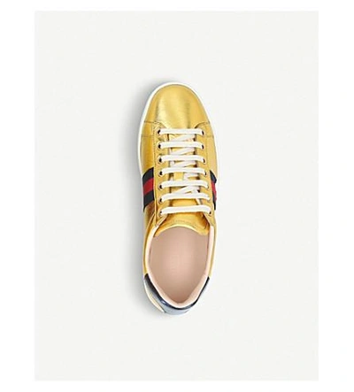 Shop Gucci New Ace Metallic Leather Trainers In Gold