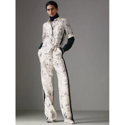 Shop Burberry Landmark Print Silk Jumpsuit In Off White/black