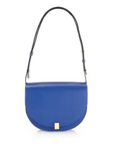 Shop Victoria Beckham Half Moon Leather Saddle Bag In Sky Blue