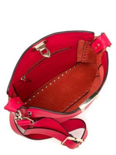 Shop Valentino Garavani Small Rockstud Leather Hobo Bag In Red
