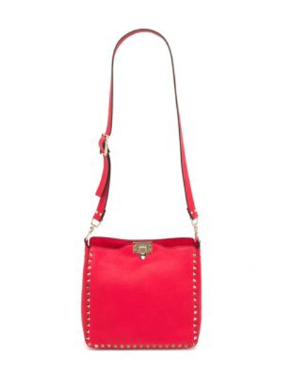 Shop Valentino Garavani Small Rockstud Leather Hobo Bag In Red