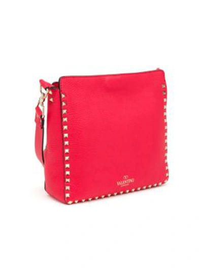 Shop Valentino Garavani Small Rockstud Leather Hobo Bag In Red